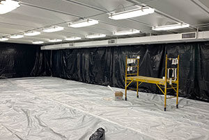 Spray foam insulation in a warehouse.