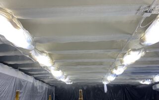 Nashville Commercial spray foam project Worker installing spray foam in a commercial space.