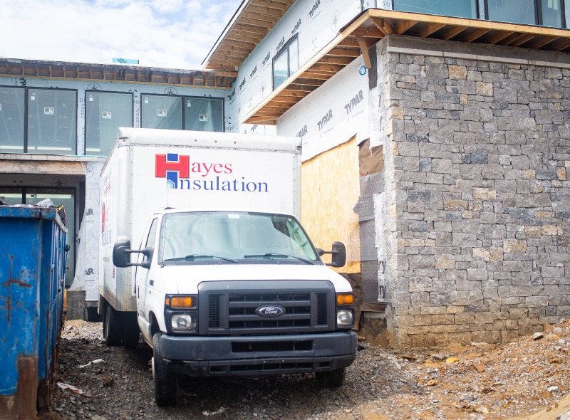 Hayes Truck outside a new home construction project