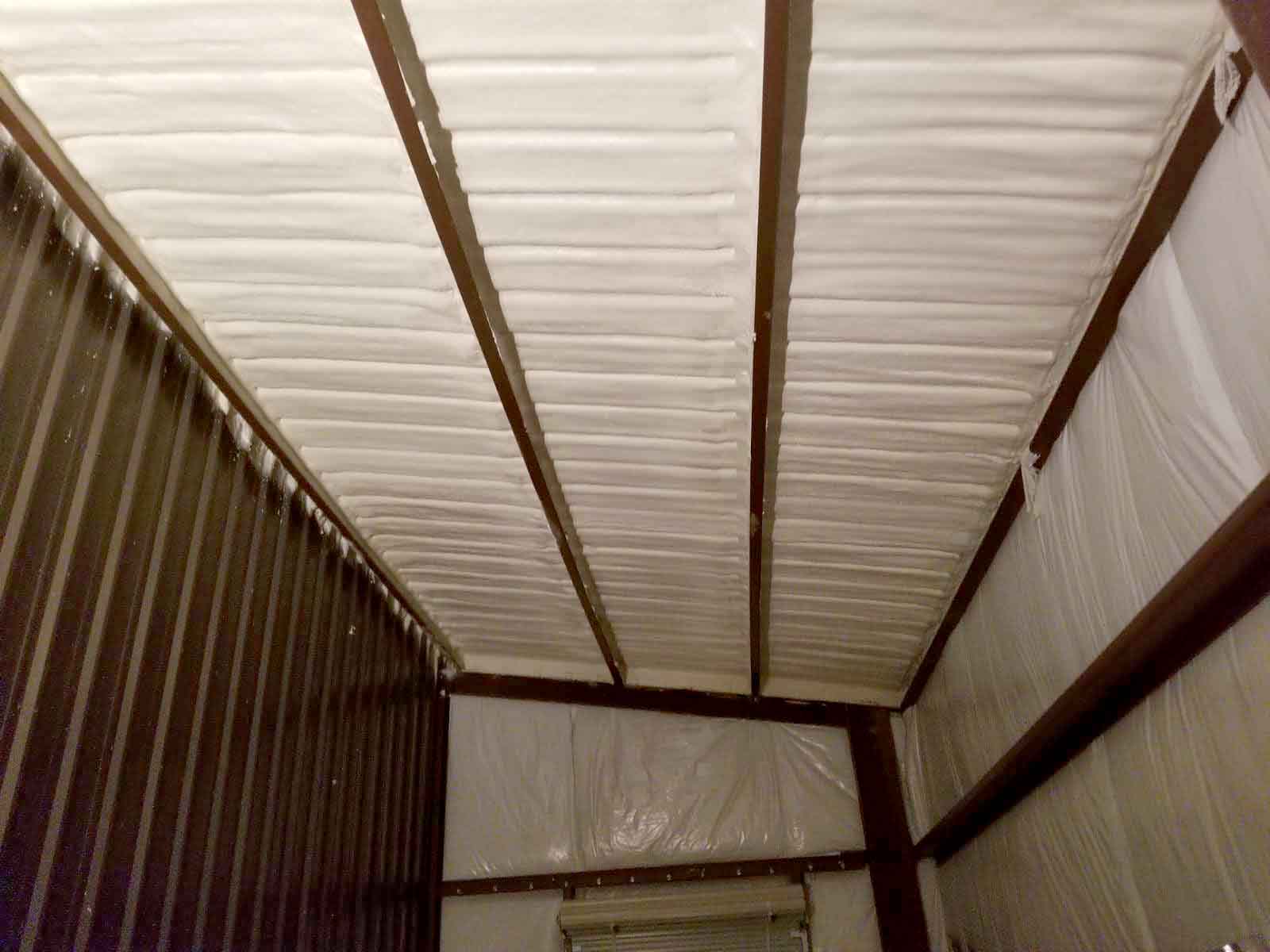Closed-cell spray foam insulation applied to metal building roof deck and rafters by Hayes Insulation in Nashville, TN.