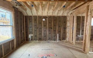 Open-cell spray foam insulation on roof deck with, at new AJSF Heritage Homes construction.